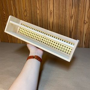 Bullseye Playground wood and cane bookshelf